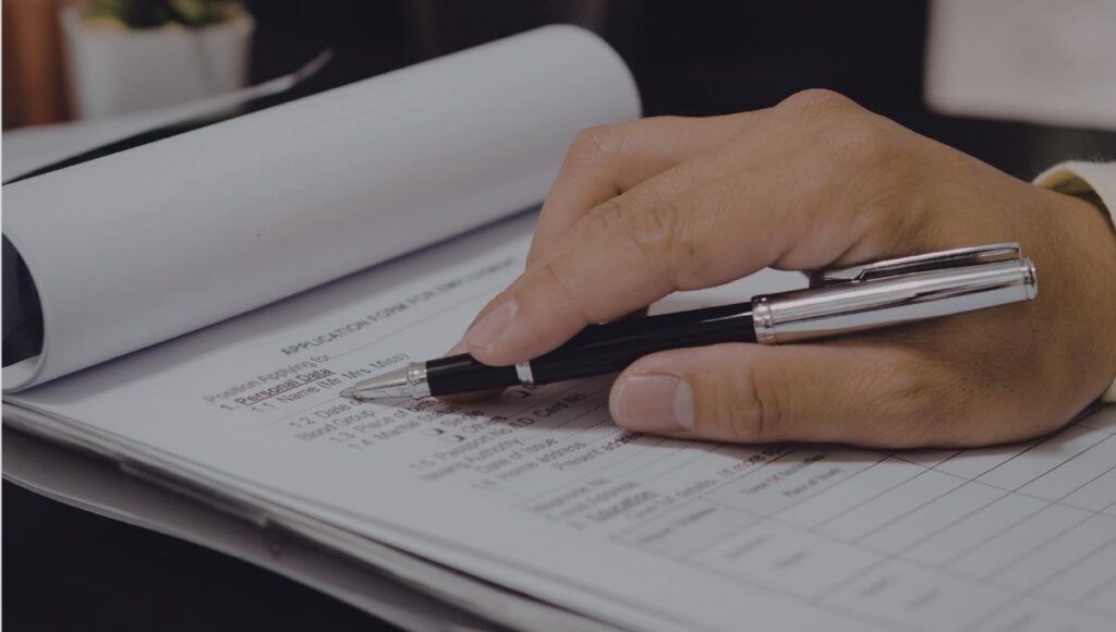 Paper request forms and documents illustrating manual internal request workflows